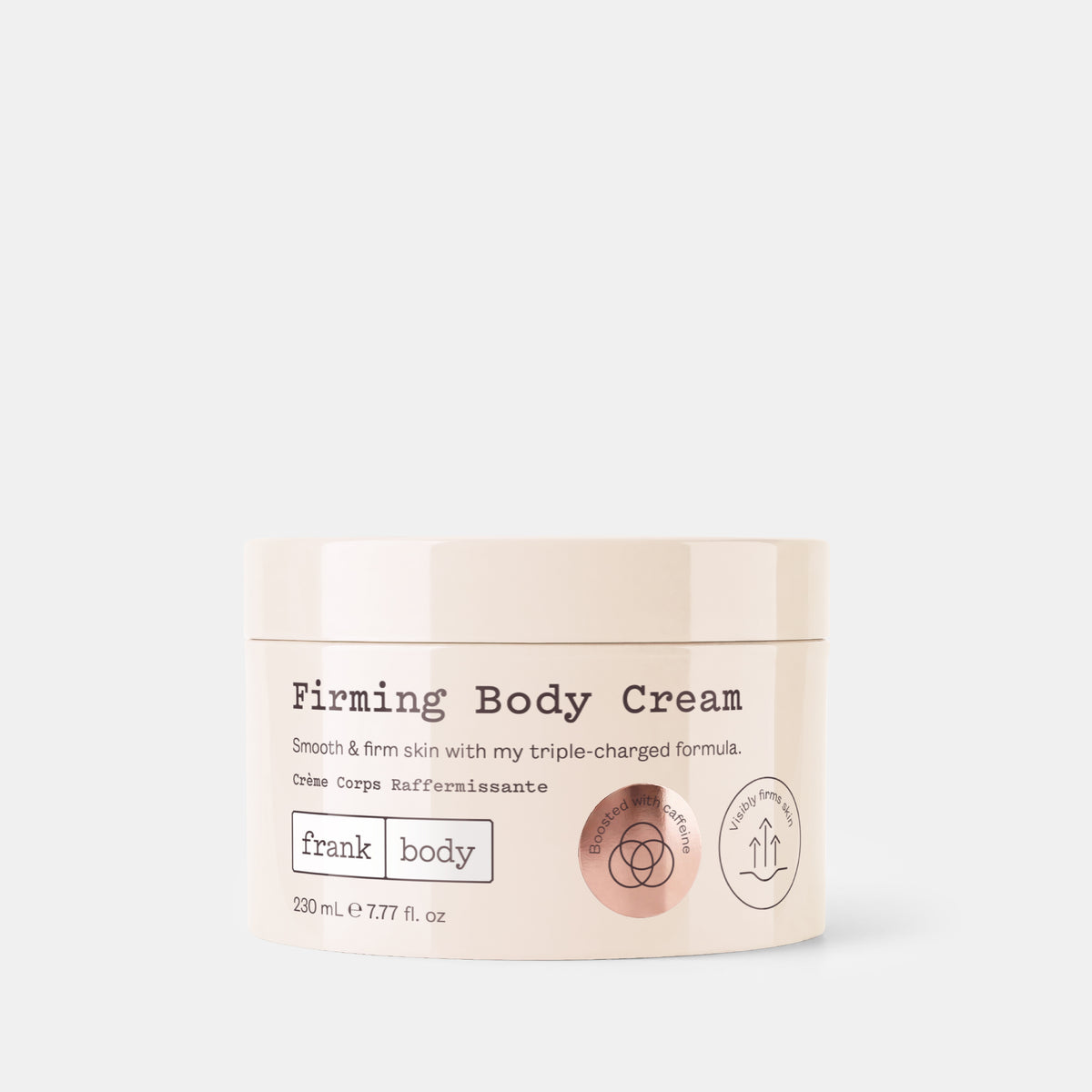 A cream-colored cosmetic jar of 'Firming Body Cream' by the brand 'frank body' on a light gray background.