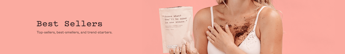 Best Sellers collection banner. A smiling woman in a white bra holding a pouch of frank body Original Coffee Scrub, the scrub dusted across her chest. Text reads: Best Sellers. Top-sellers, best-smellers, and trend-starters.