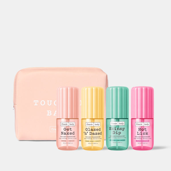 The frank body All You Can Spritz Kit: Get Naked, Glazed 'n' Dazed, Skinny Dip and Hot Lick hair and body mists with a pink pouch.