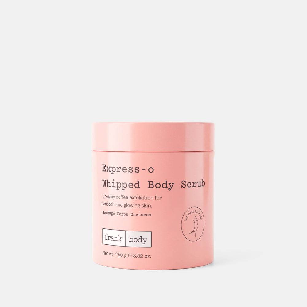 A pink cylindrical tub of Frank Body Express-o Whipped Body Scrub on a light gray background.