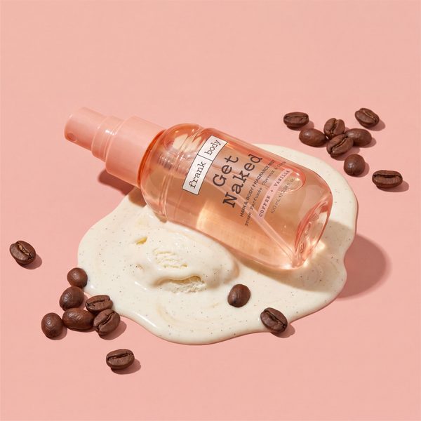 A bottle of frank body On-the-Go Get Naked Hair & Body Fragrance Mist on a scoop of ice cream with coffee beans.