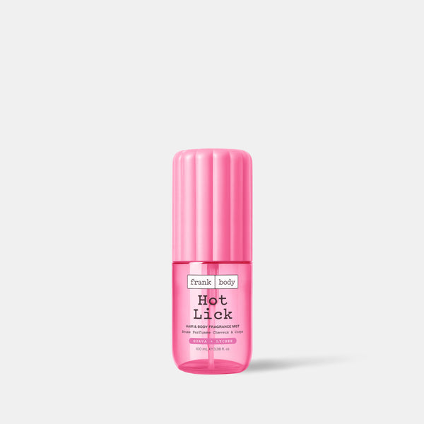 A 100ml bottle of frank body On-the-Go Hot Lick Hair & Body Fragrance Mist in guava and lychee.