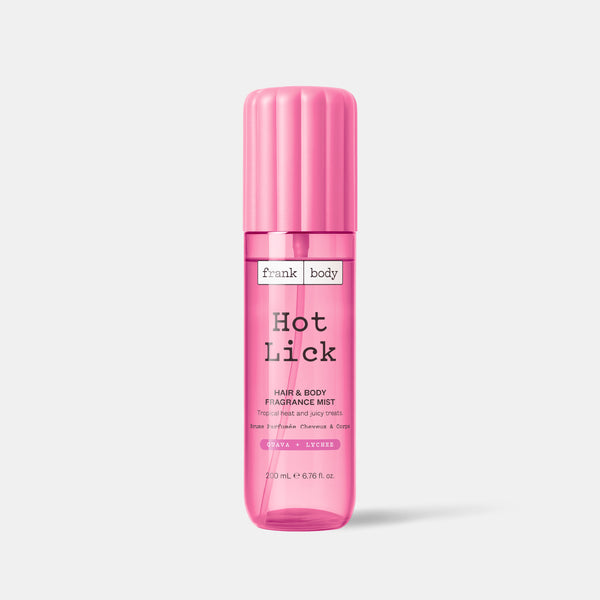 A pink bottle of frank body Hot Lick Hair & Body Fragrance Mist in guava and lychee, 200ml.