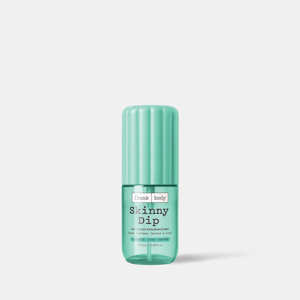 A 100ml mint green bottle of frank body On-the-Go Skinny Dip Hair & Body Fragrance Mist in coconut.