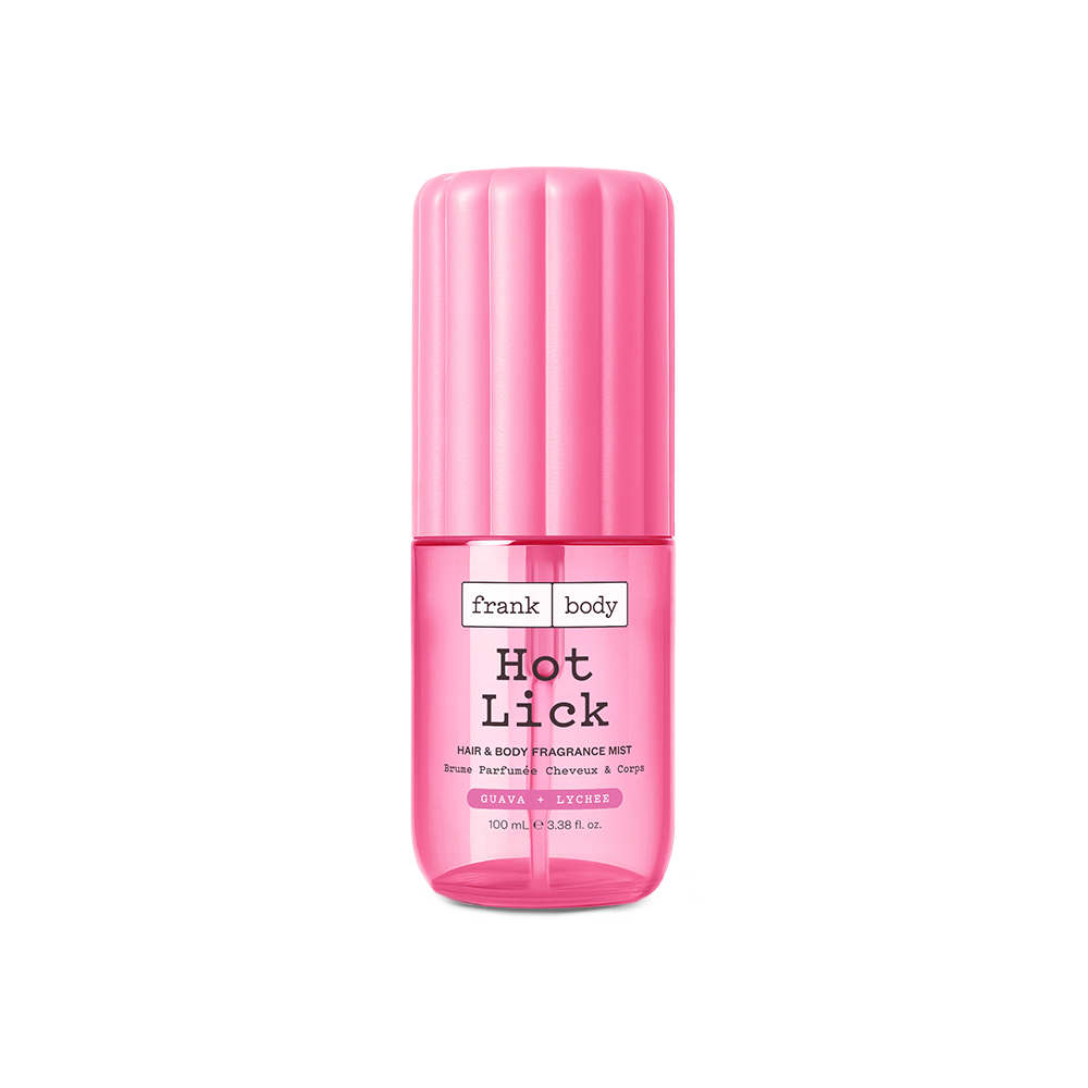 A pink 100ml bottle of frank body Hot Lick Hair & Body Fragrance Mist in guava and lychee.