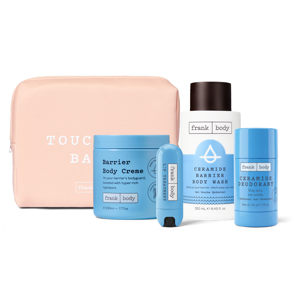 A Frank Body self-care gift set featuring a light pink zippered pouch, a blue Barrier Body Creme jar, a white Ceramide Barrier Body Wash bottle, a blue lip balm tube, and a blue Ceramide Deodorant stick, arranged on a white background.