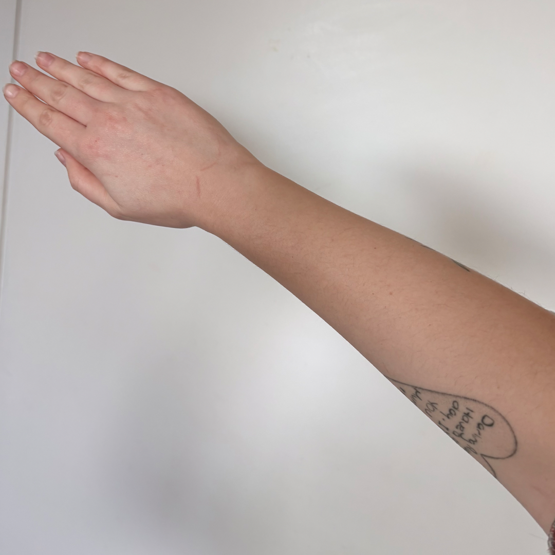 Before using frank body Firm + Glow Tan Butter: a pale, untanned stomach and torso.