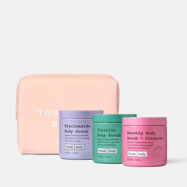 The frank body Triple Tub Rub Kit: Niacinamide Body Scrub, Glycolic Body Scrub and Rosehip Body Scrub + Cleanser with a pink Touch Babe pouch.