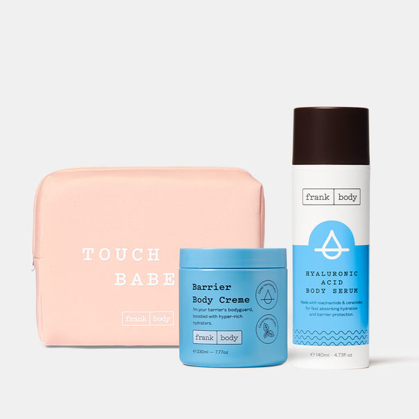 The frank body Juicy Treats Kit: Barrier Body Creme and Hyaluronic Acid Body Serum with a pink Touch Babe pouch.